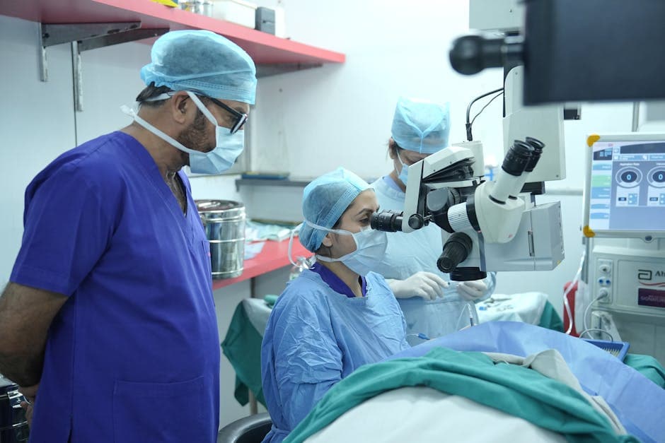 Elderly patient undergoing cataract surgery with advanced surgical equipment