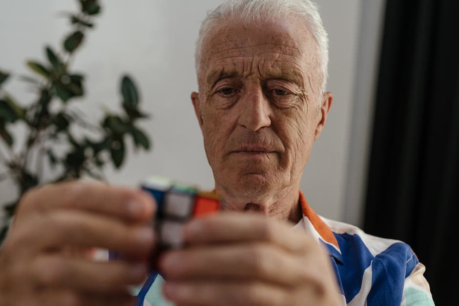 An elderly person undergoing cognitive assessment at a neurology clinic