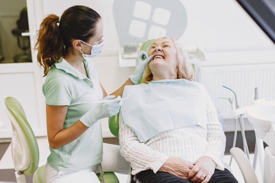 A dentist examining an elderly patient's oral health at a clinic
