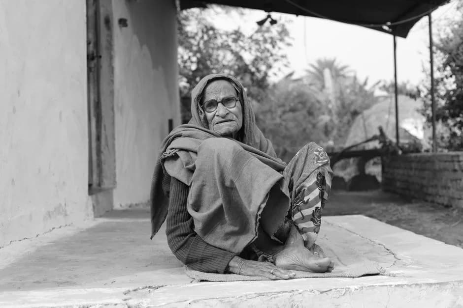 Elderly Indian woman sitting alone at home