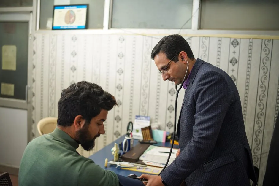 Doctor consulting a male patient during a checkup