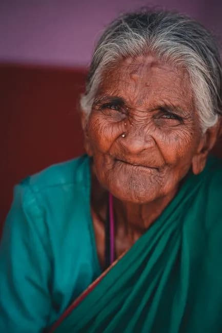 Elderly Indian woman looking pensive and worried