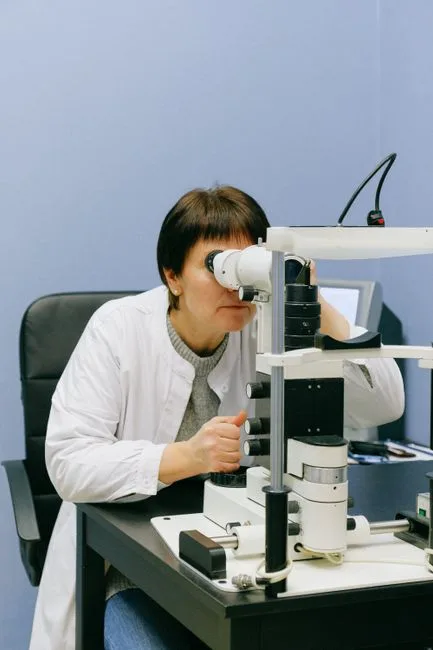 Patient having an eye exam with a phoropter