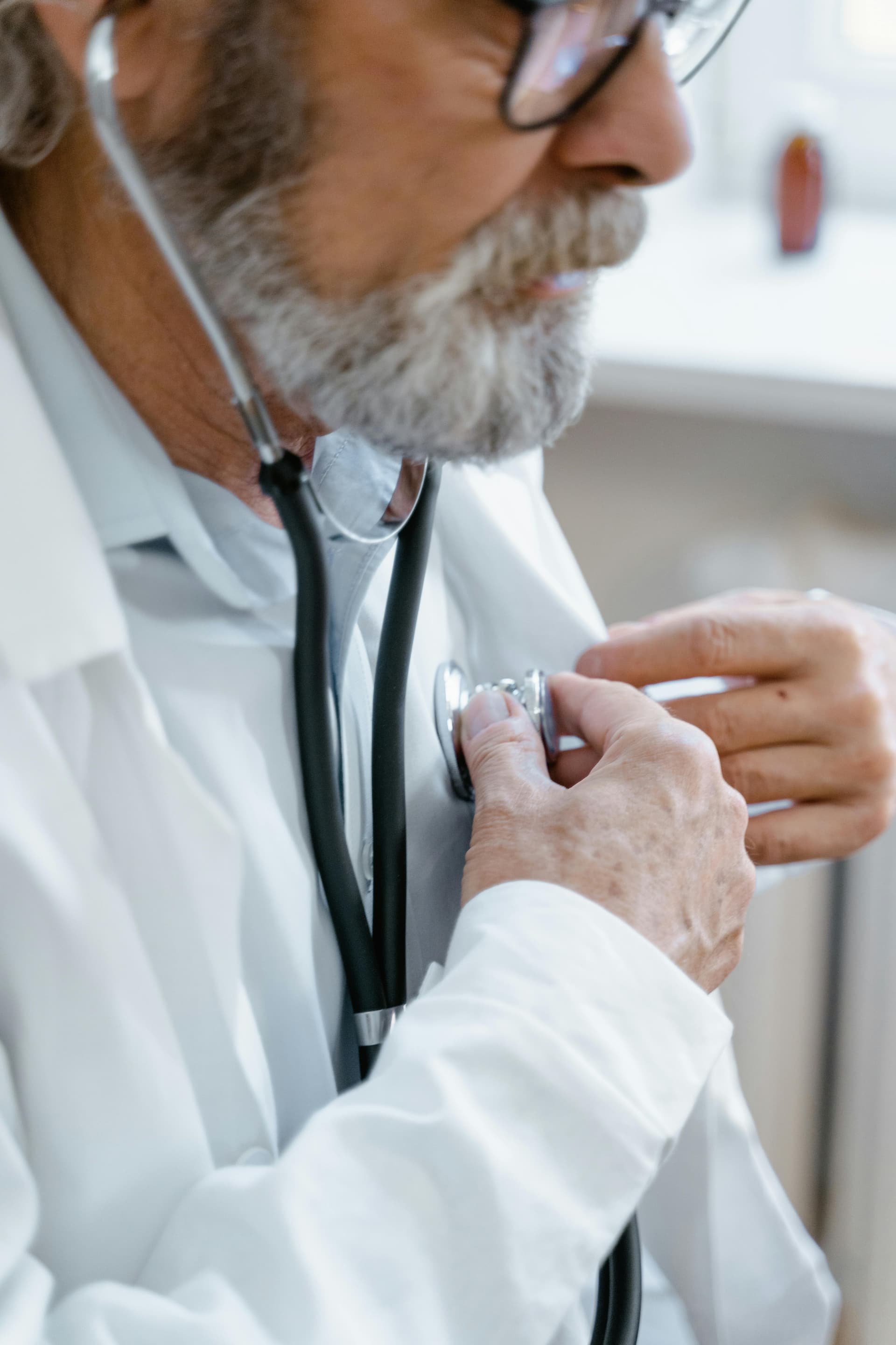 Elderly patient getting health screening and vital signs checked