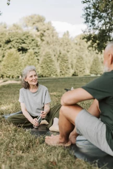 Elderly couple exercising together outdoors