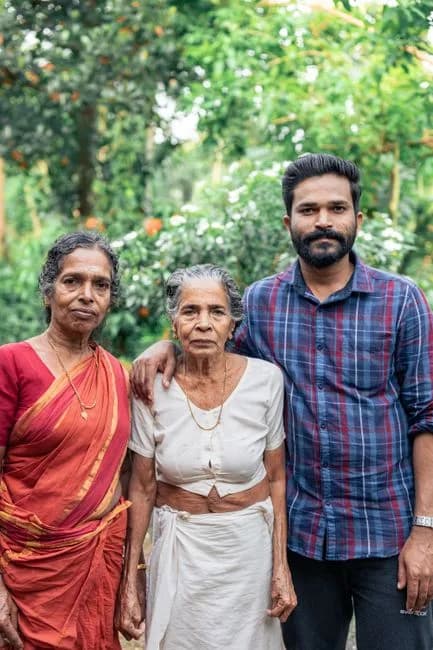 Elderly Indian women with an adult son outdoors