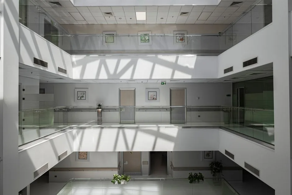 Hospital atrium interior with patient room doors
